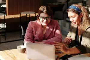 two women with a laptop