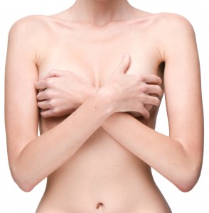 Woman covering breasts