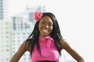 smiling woman with flower in her hair